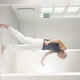 Man Performs Elements of Modern Dance From a White Studio - VideoHive Item for Sale