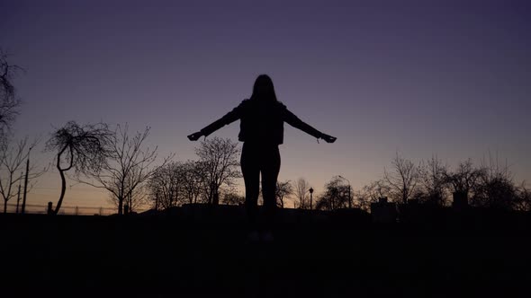 Silhouette Of A Girl Doing Yoga Exercises