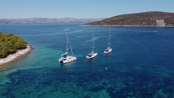 Aerial Flight Under the Anchored Boats