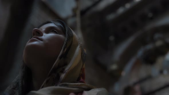 Woman looking up while in church