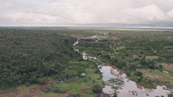 River and savanna wildlife conservation reserve in Laikipia, Kenya. Aerial drone view