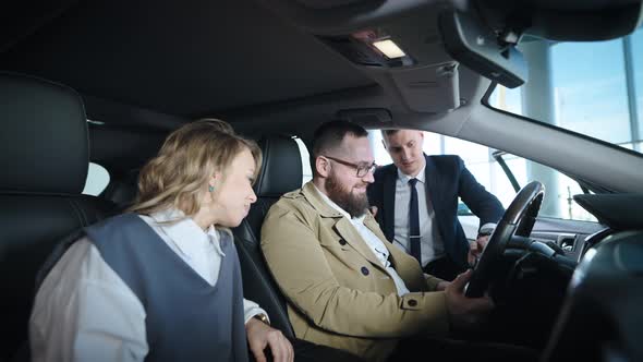 A Married Couple in a Large Car Dealership