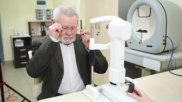 Ophthalmologist Examination of Elderly Man on Corneo Topographer