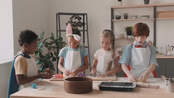 Diverse Children Working in Kitchen