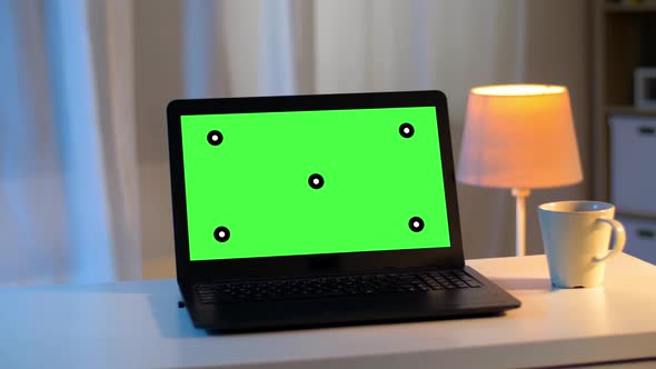 Laptop with Chroma Key Green Screen on Table 