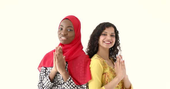 African and Asian Women Together on White Background