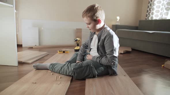Child Sits on Furniture Panels