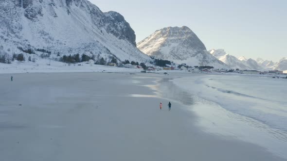 Children On A Winter Polar Beach