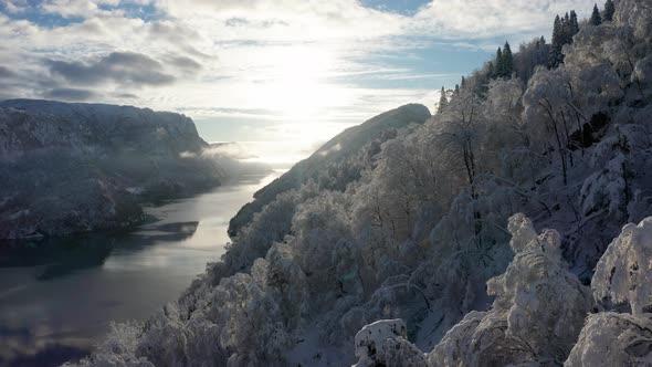 Fairytale magical snow hill Norwegian fjord Veafjorden Europe winter