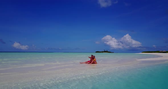 Romantic lady and man in love dating on vacation enjoy luxury on beach on summer white sandy 