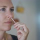 Close Up of Woman Performing at Home Nasal PCR Self Test for Covid19 - VideoHive Item for Sale