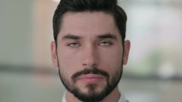 Close Up of Young Man Looking at the Camera