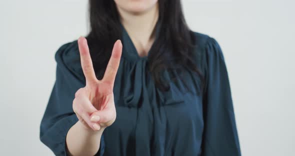 Woman showing the victory sign