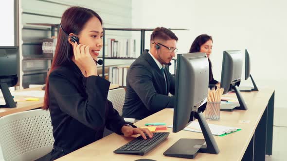 Business People Wearing Headset Working in Office