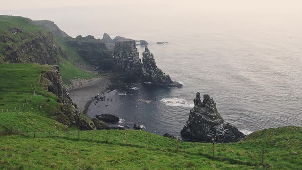 Green Mountain Cliffs With Seabirds Flying At The Bird Sanctuary In Rathlin Island, Northern Ireland