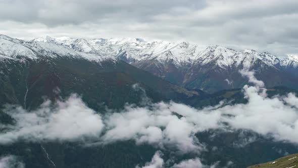 Mountain Valley with Fog and Clouds at Morning