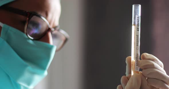 Doctor holding a coronavirus COVID-19 test tube