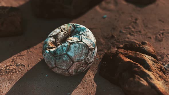 Old Leather Soccer Ball Abandoned on Sand