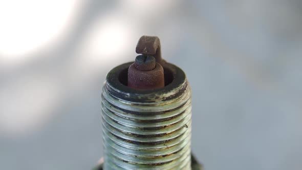 View of an Old Spark Plug. Rotation.