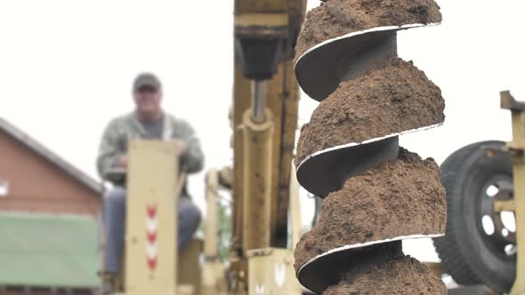 Drilling Rig Machine Drills the Ground. Holes Boring for Saws and Foundation on Construction