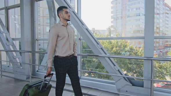 Calm Confident Lonely Hispanic Businessman Traveler Man Male Guy Wears Formal Suit Walking in