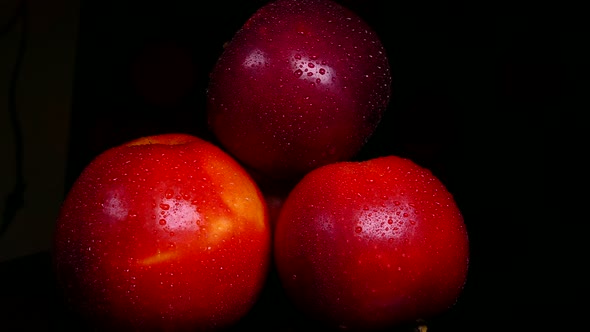 Ripe Red Apples on a Black Background