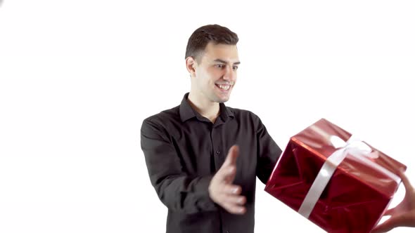 Happy Young Man Gets a Gift