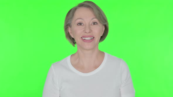 Old Woman Talking on Video Call on Green Background