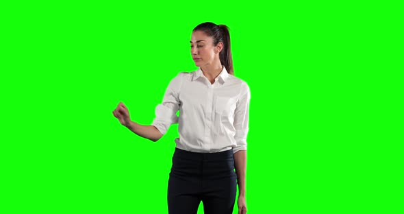 a Caucasian woman in suit in a green background