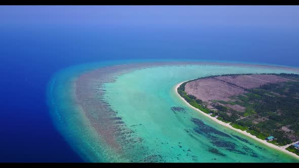 Aerial drone shot landscape of tranquil lagoon beach journey by blue green water and white sand back