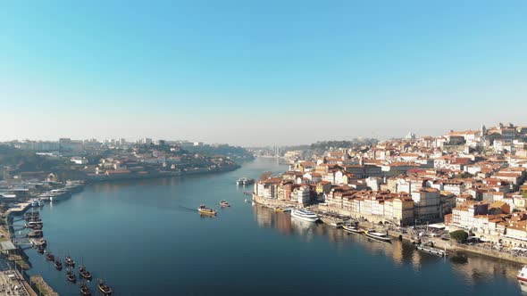 4k aerial drone footage of the river channel of coastal city of Porto in northwest Portugal