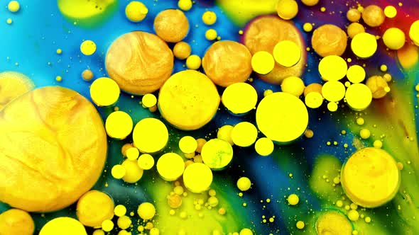 Blue and Yellow Inks React To Form a Beautiful Structure of Paint Bubbles. Colorful Liquid Ink