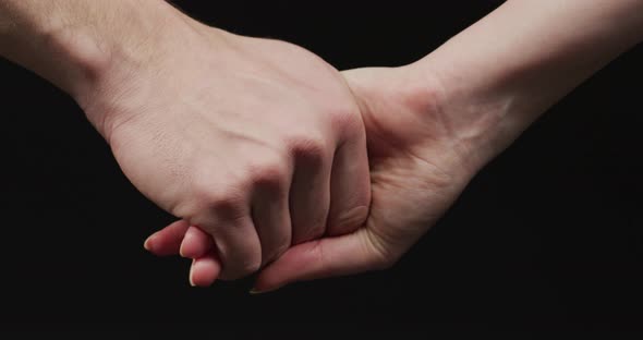 Woman holding man's hand alt