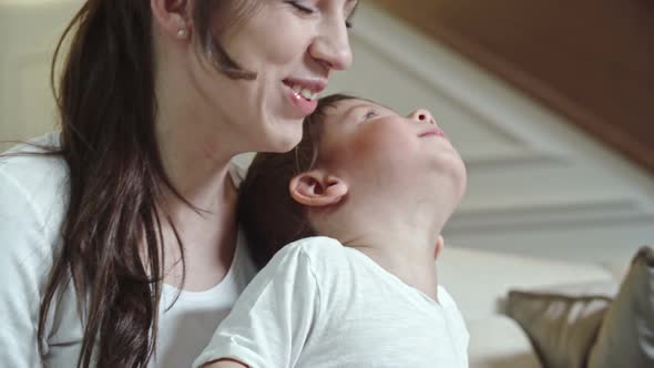 Woman Playing on Tablet with Child alt