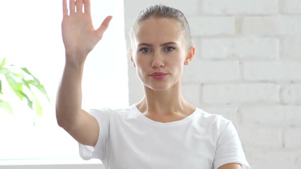 Stop Sign with Hand By Young Woman Portrait