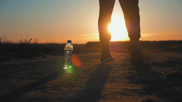 Running Man Silhouette in Sunset Time. Outdoor Cross-country Running. Athletic Young Man Is Running