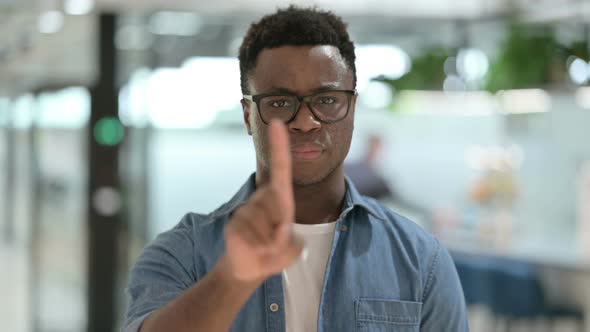 Portrait of Young African Man Showing No Sign By Finger Sign