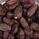 dried large dates on a metal plate that rotates - VideoHive Item for Sale