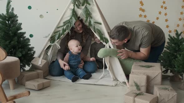 Dad Playing with Children on Christmas Day