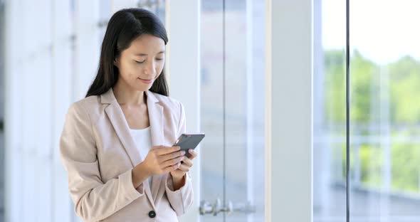 Business woman working on cellphone 