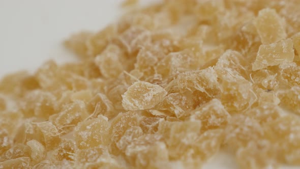 Close-up pile of Candied ginger root on the table  slow tilt 4K 2160p 30fps UltraHD footage - Crysta