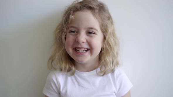 Cheerful cute girl smiling in studio