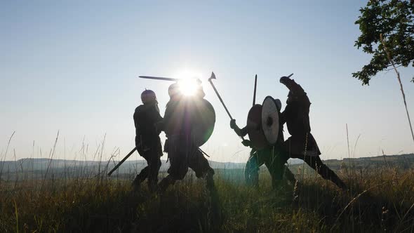 Silhouettes of Vikings Warriors Fighting with Swords, Shields