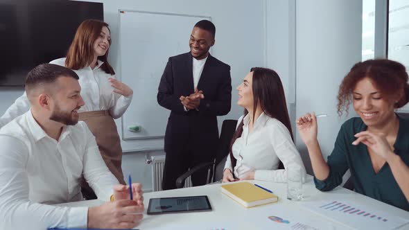 Team of multiethnic managers smiling at meeting