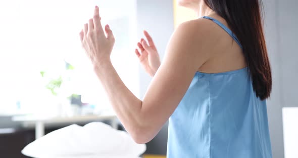 Calm Brunette Doing Yoga on Bed at Home in Bedroom Closeup