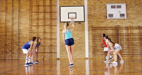 Group of high school kids playing basketball