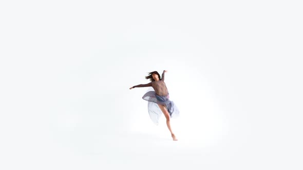 Young Woman Doing Modern Dance On A White Background 2