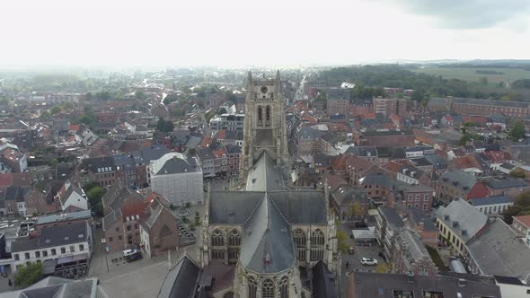 Flying Over Basilica of Our Lady Towards Its Clock Tower In Tongeren, Belgium.