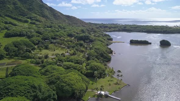 Aerial view of Moli'i pond next to Ko'olau mountain in Oahu Hawaii