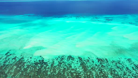 Aerial view abstract of marine coastline beach time by blue lagoon and white sandy background of a d